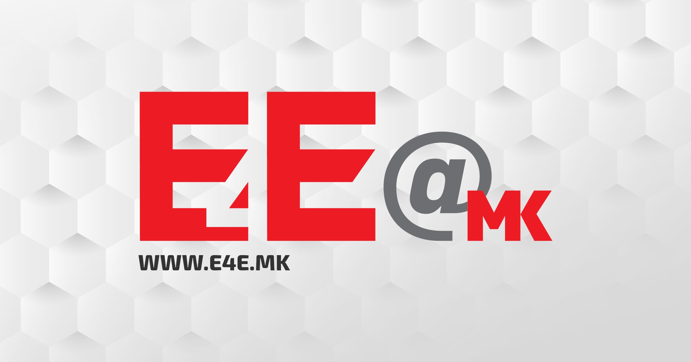 Logo des E4E@mk in roter, grauer Farbe, sowie die Angabe der Website auf einem weissen hexagonalen Hintergrund und das Projekt selbst nun in die zweite Phase startet.